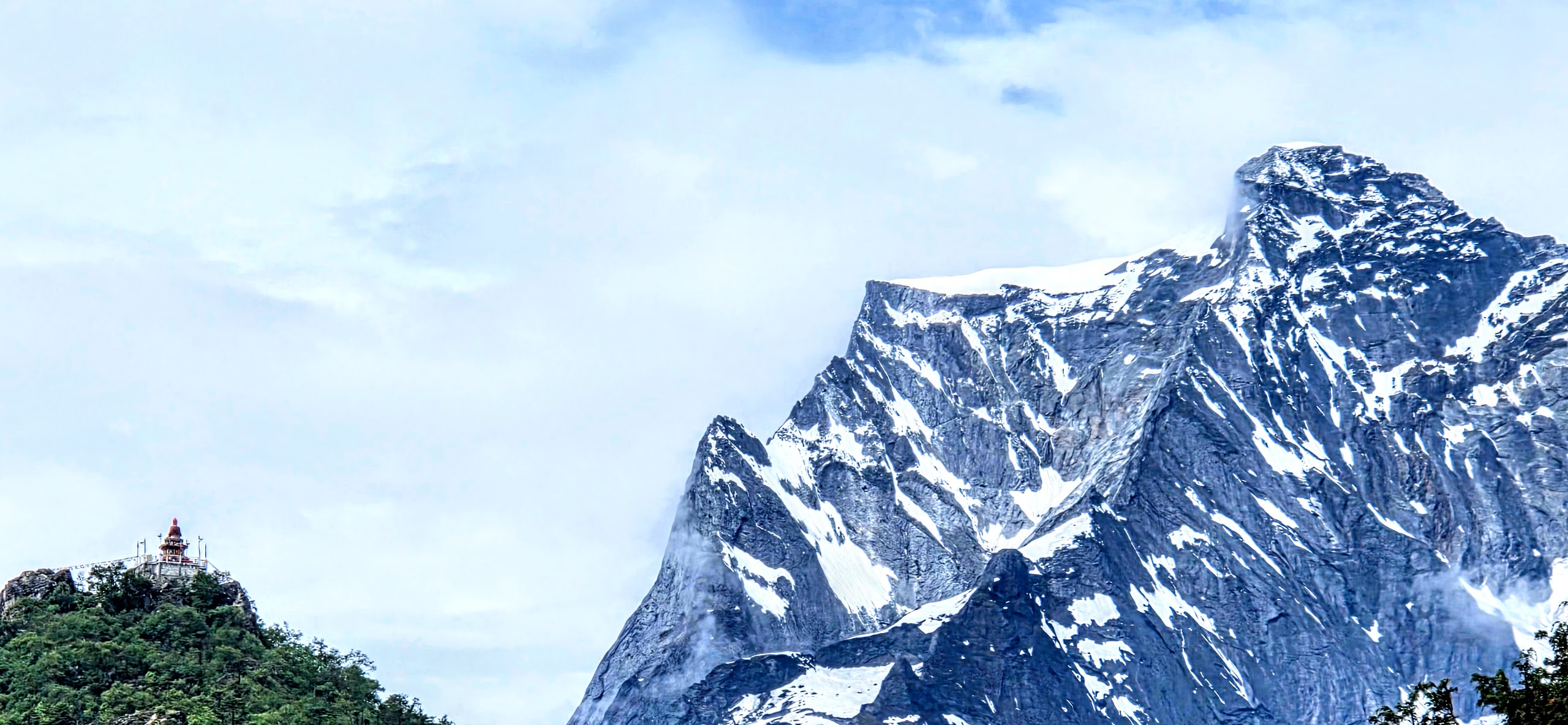 A golden statue of Buddha overlooking the Khumbu Valley beneath Kongde Ri in Nepal